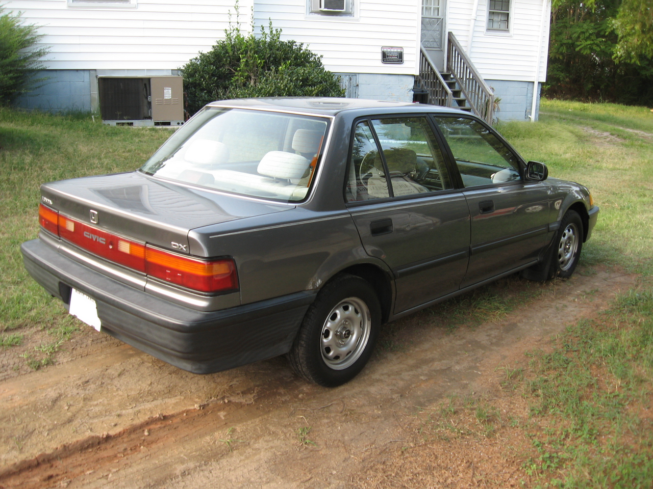 Rear three-quarter view of a 1990 Honda Civic DX showing its generation-specific tail lights
