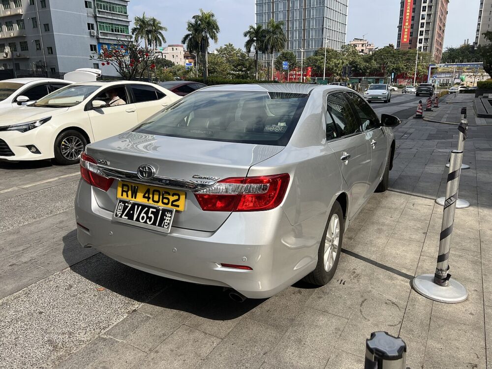 Rear view of a Toyota Camry showing the trunk lid and latch area.