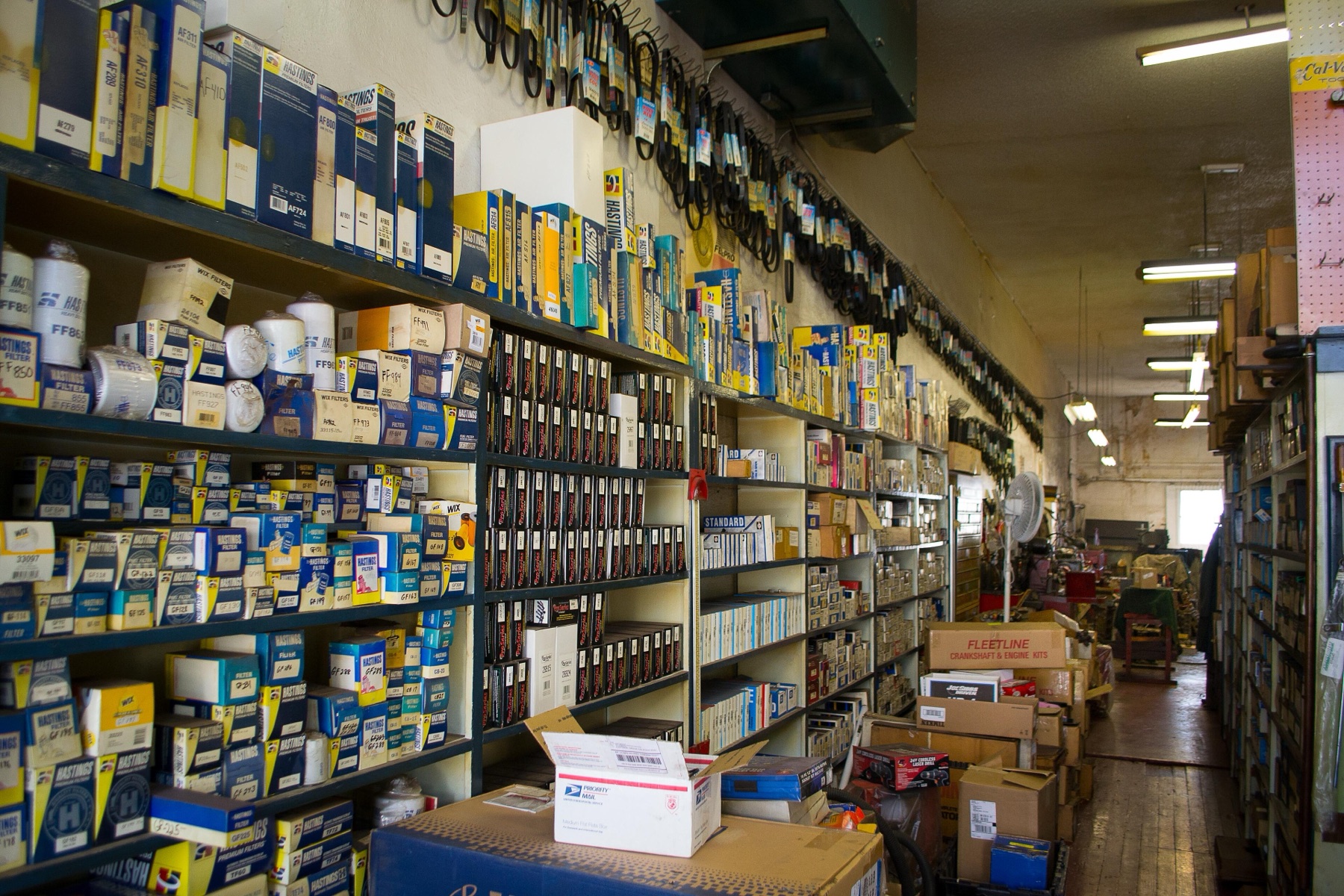 Shelves of transmission and auto parts in a store
