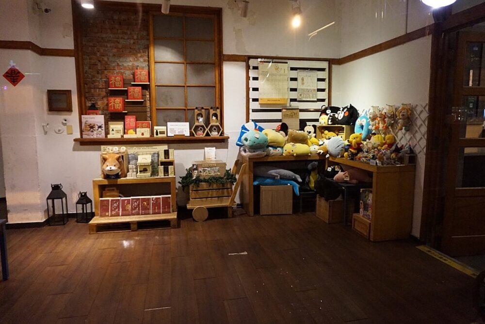 Retail shelf full of assorted plush toys, illustrating variety in size and style