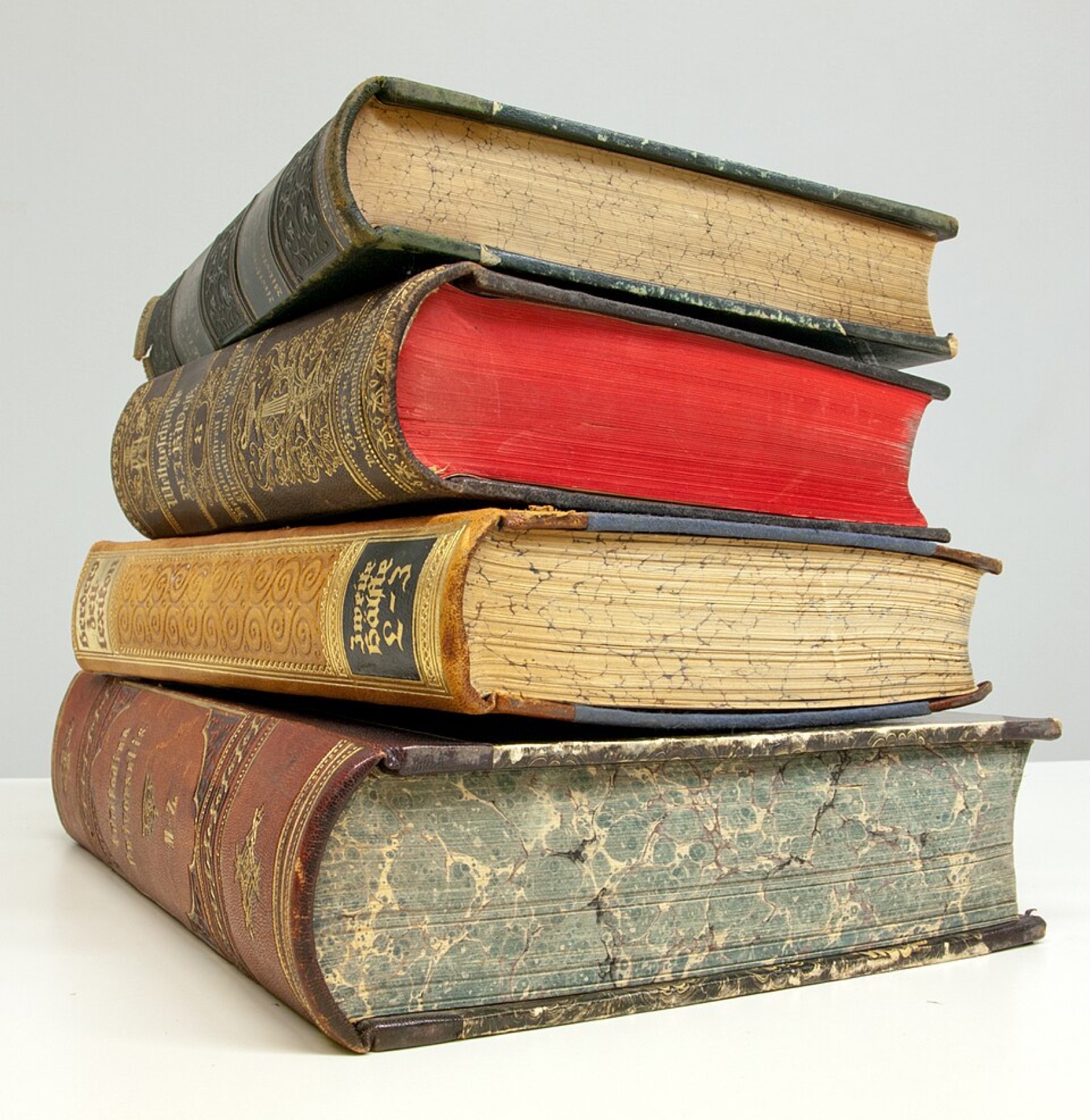 Stack of old books illustrating physical print choices