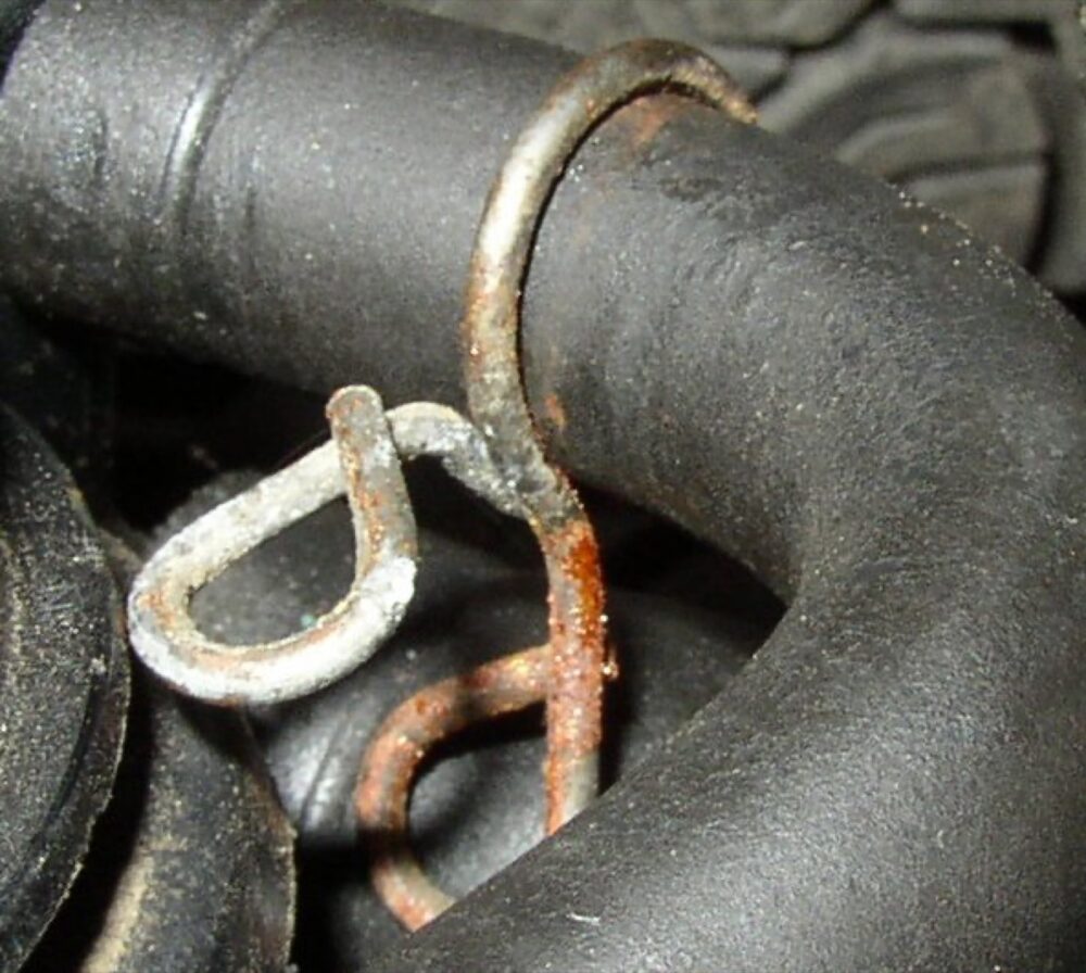 Close-up metal hose clamp on a hose