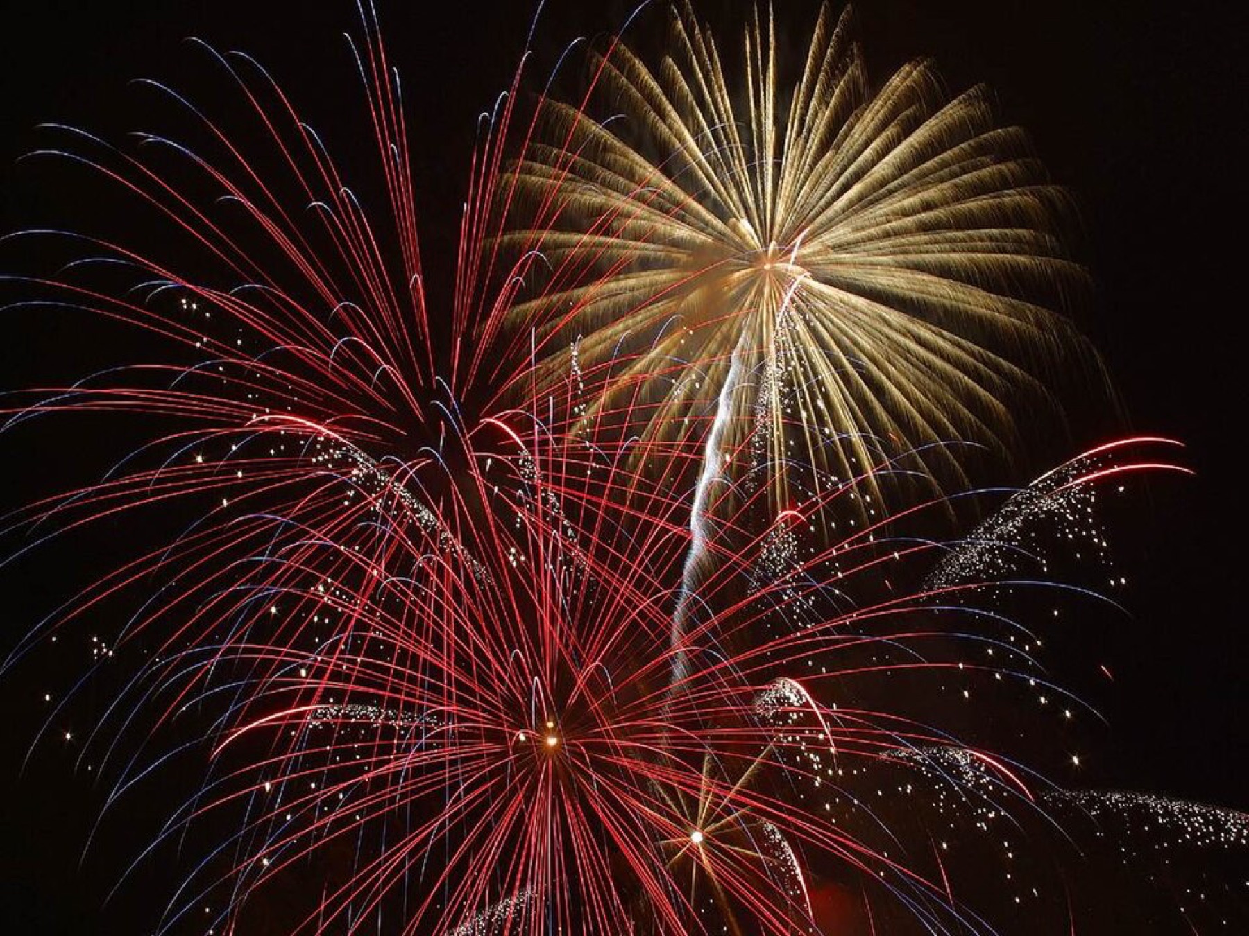 Firework-style burst of light against a dark sky