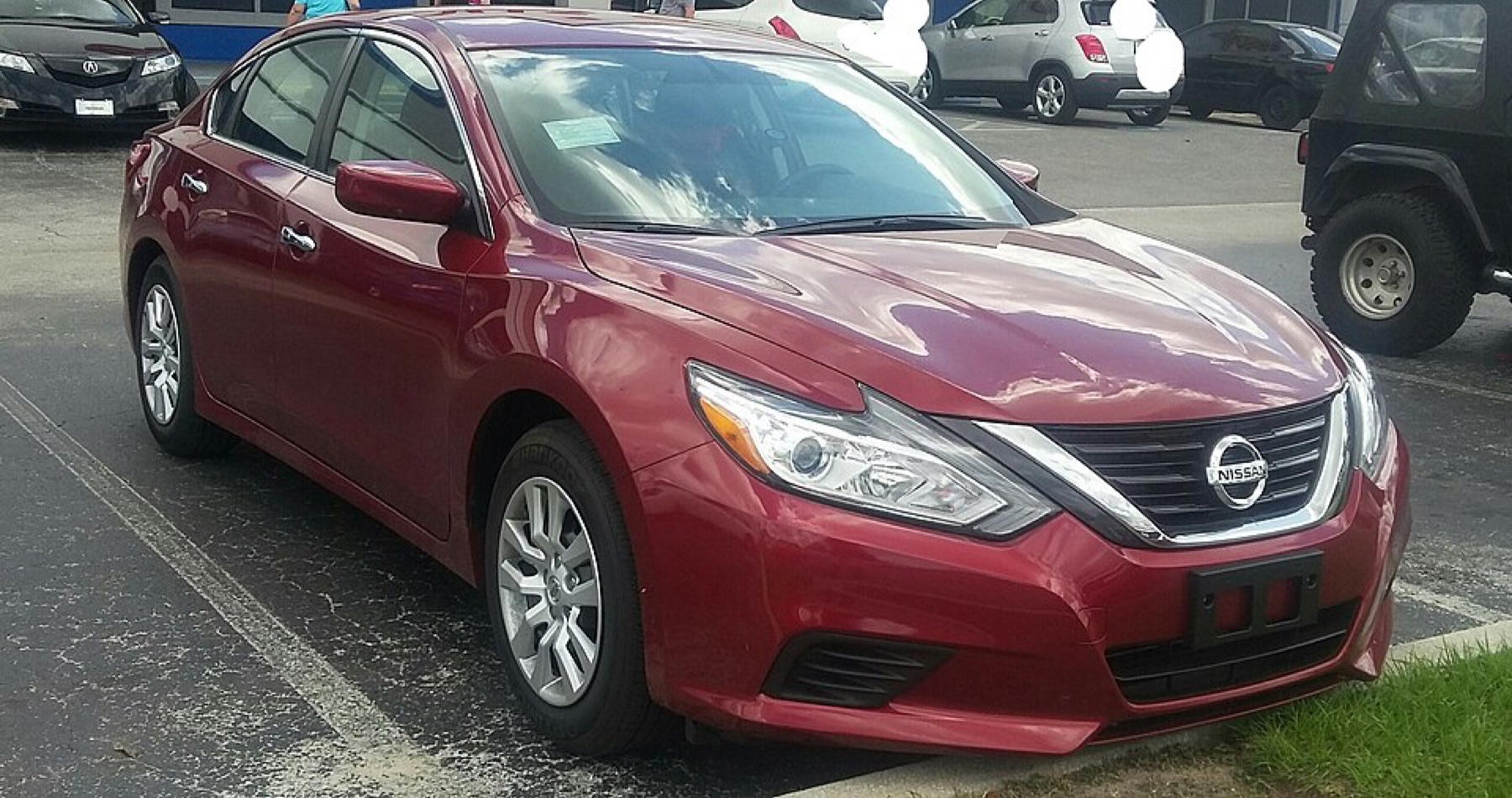 Nissan Altima sedan illustrating OEM-style alloy wheel fitment context for sourcing decisions.