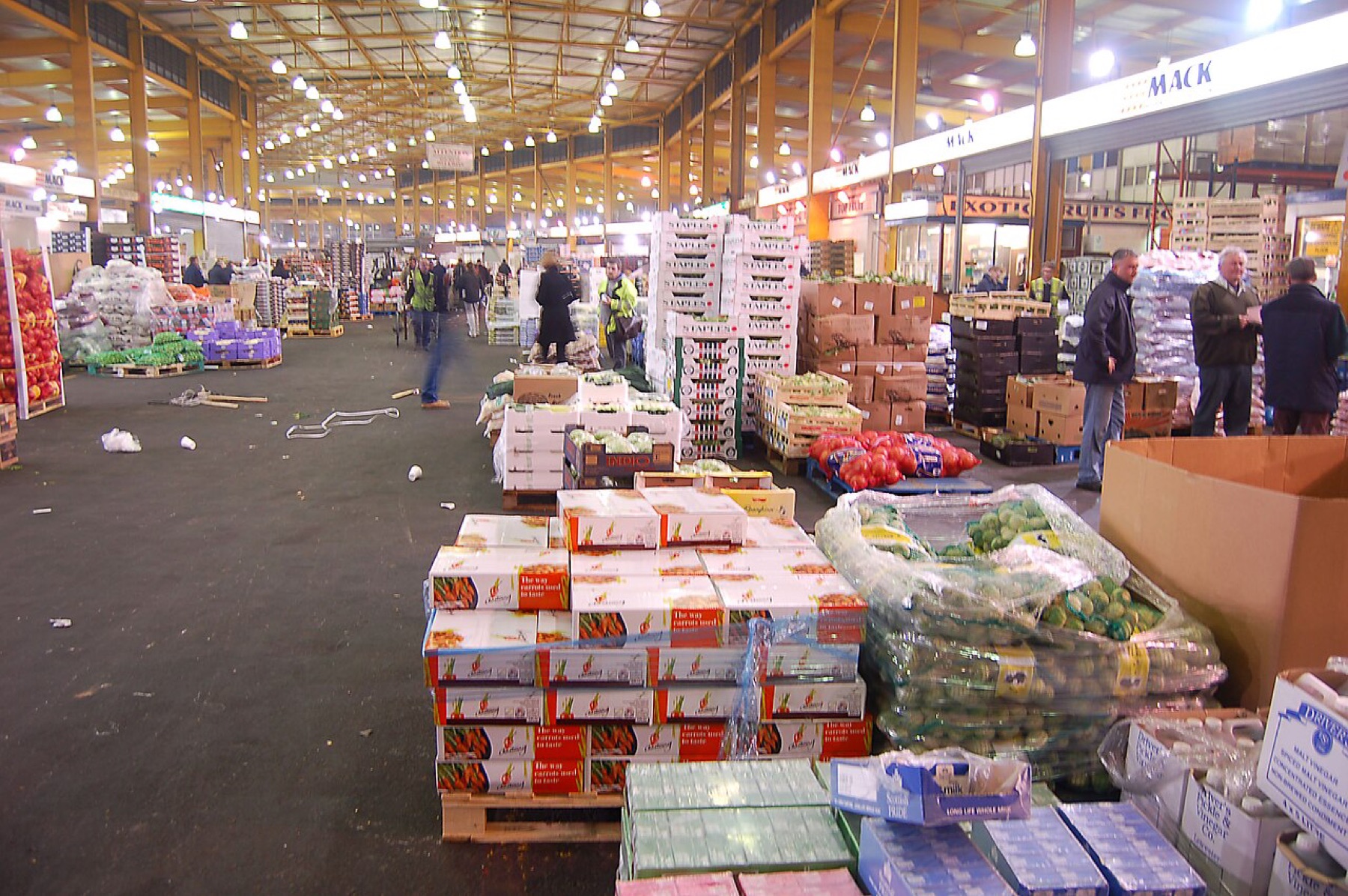 Wholesale market hall showing stacked goods and loading area