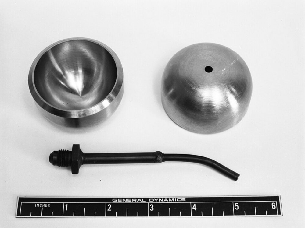 Assorted mechanical components laid out on a table, illustrating the variety of parts that must be sourced and matched correctly.