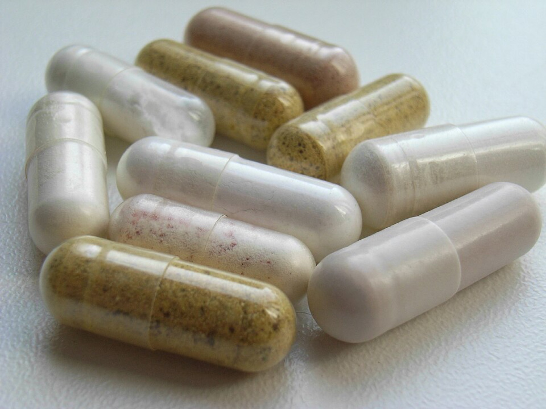 Close-up of assorted ingestible capsules, highlighting shells that customers actually swallow
