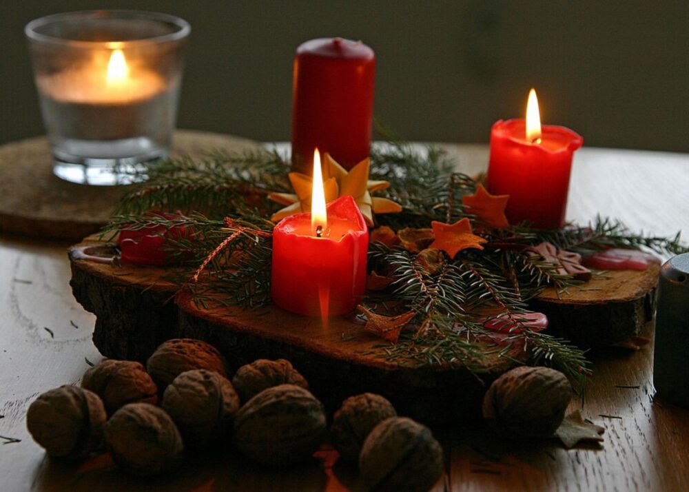 Red and white Christmas candles arranged on a festive table