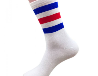 Bulk tube socks stacked on a shelf, illustrating inventory volume for cost comparisons