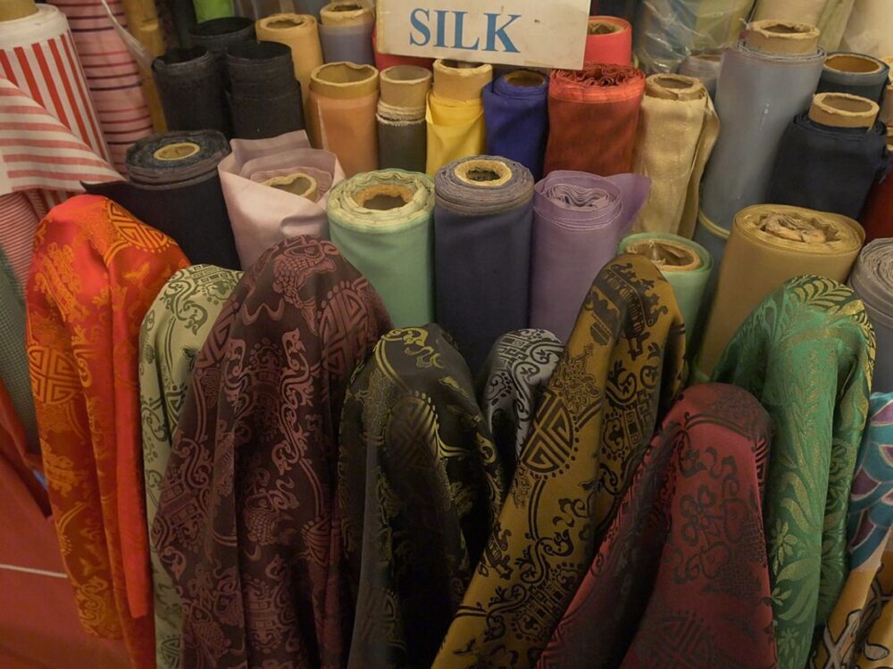 Clothing wholesale stalls inside a Chinese fabric and apparel market