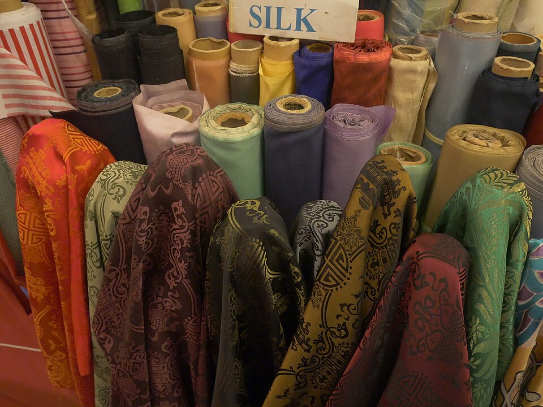 Clothing wholesale stalls inside a Chinese fabric and apparel market
