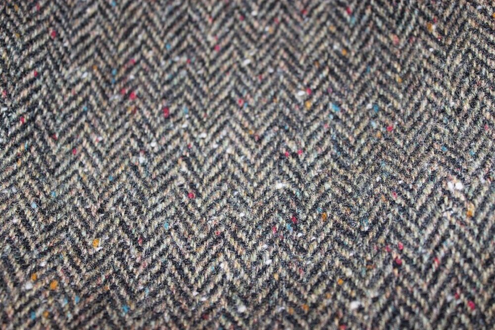 Close-up of Donegal tweed showing colorful flecks and coarse weave