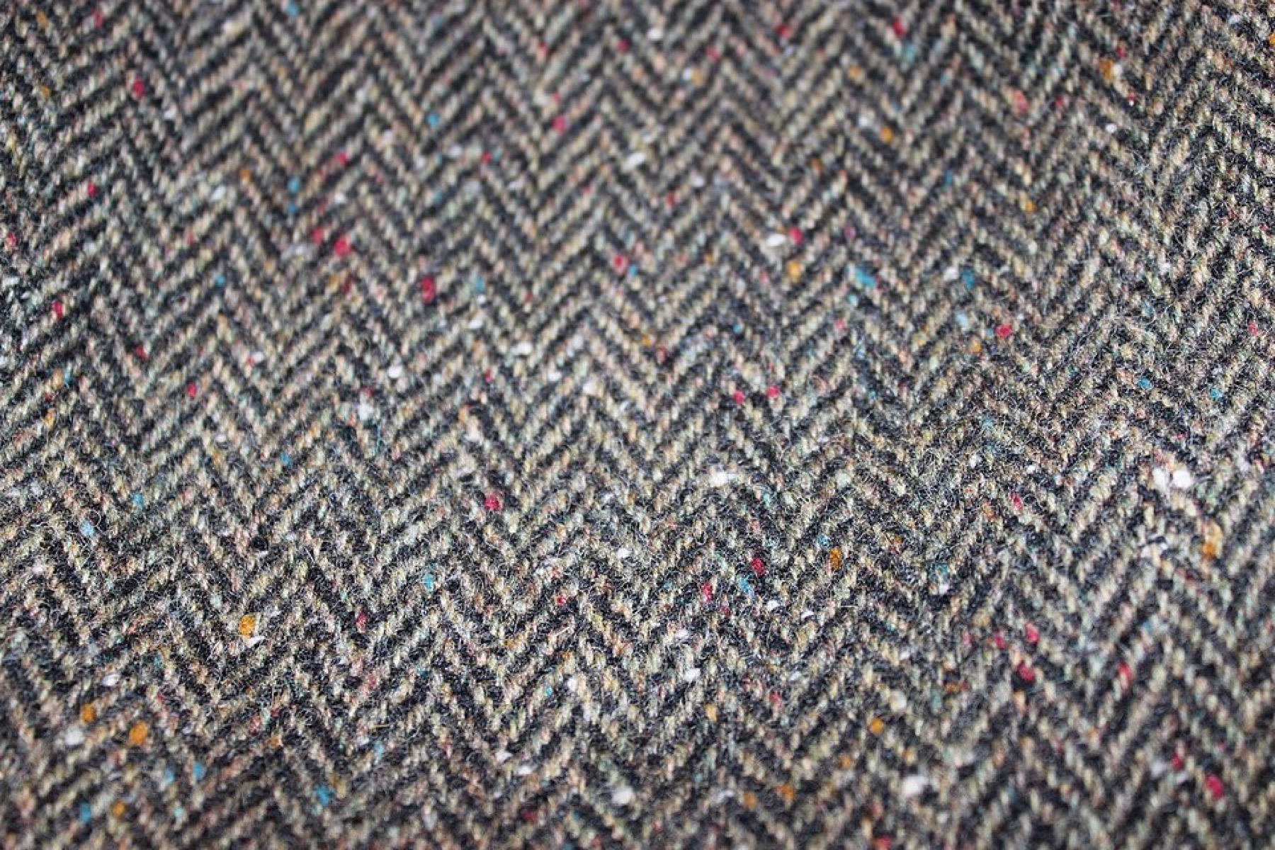 Close-up of Donegal tweed showing colorful flecks and coarse weave