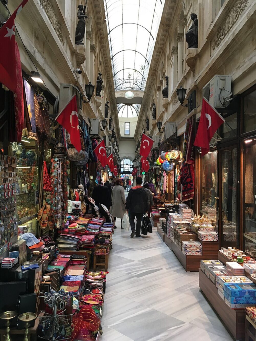Crowded Turkish bazaar with clothing and textiles on display