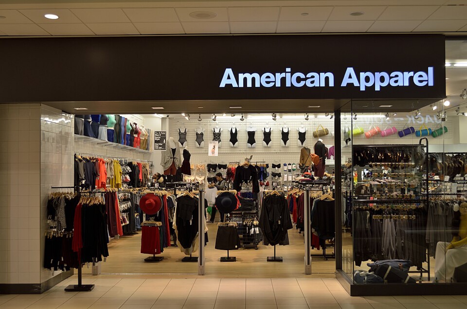 Exterior view of an apparel store, illustrating wholesale-to-retail clothing flow