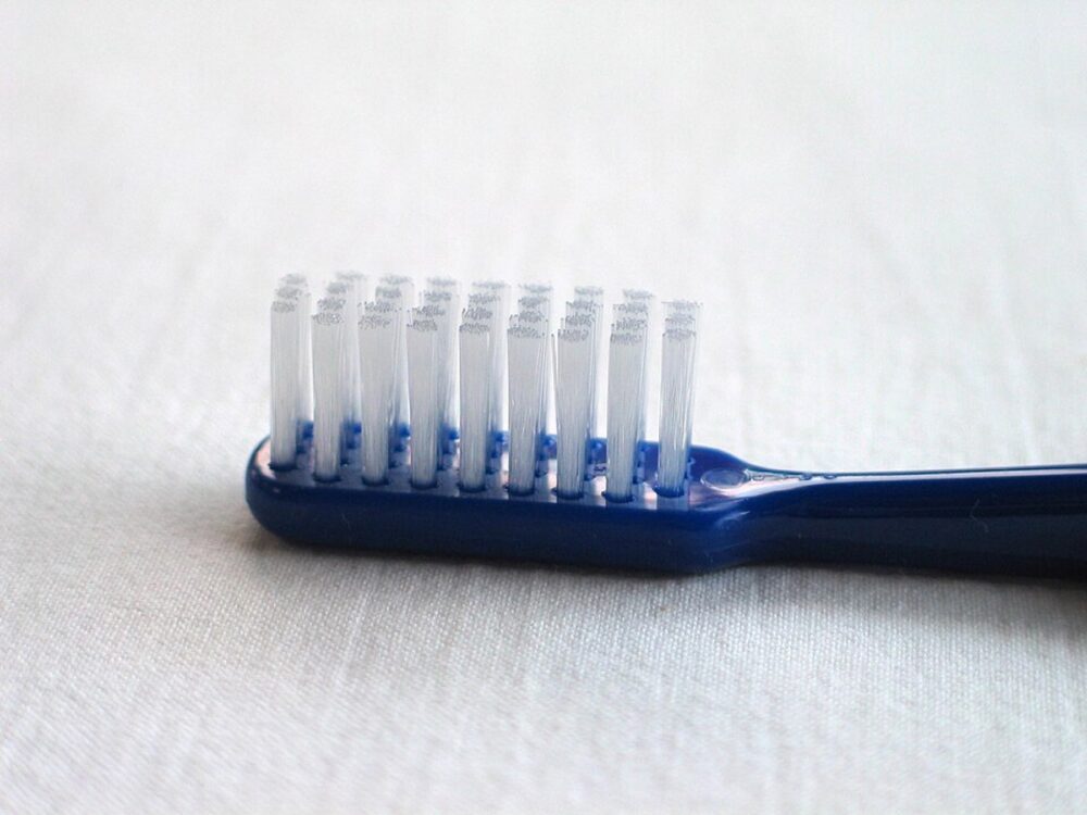 Manual toothbrush close-up suitable for illustrating toothbrush supply discussions