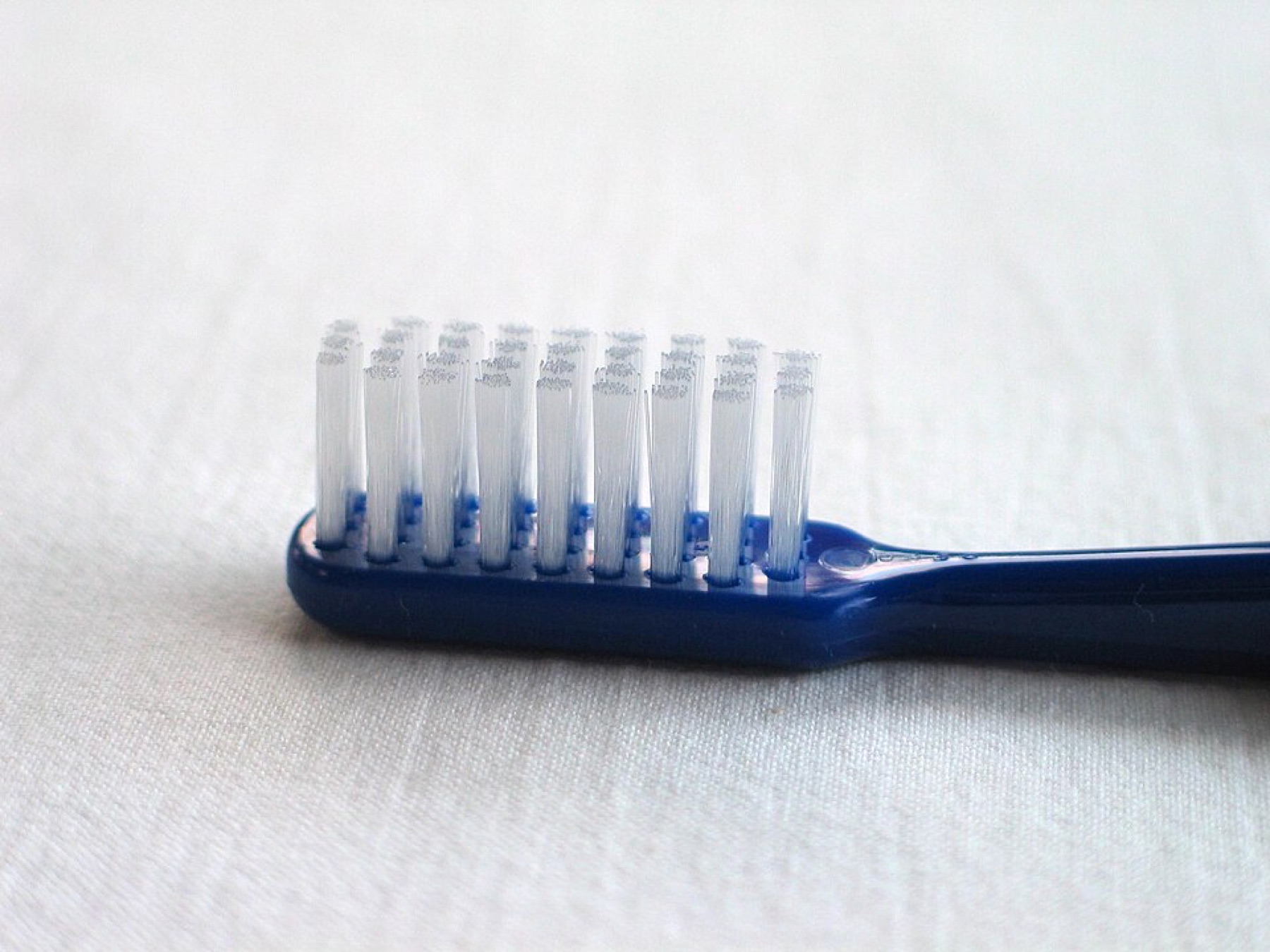 Manual toothbrush close-up suitable for illustrating toothbrush supply discussions