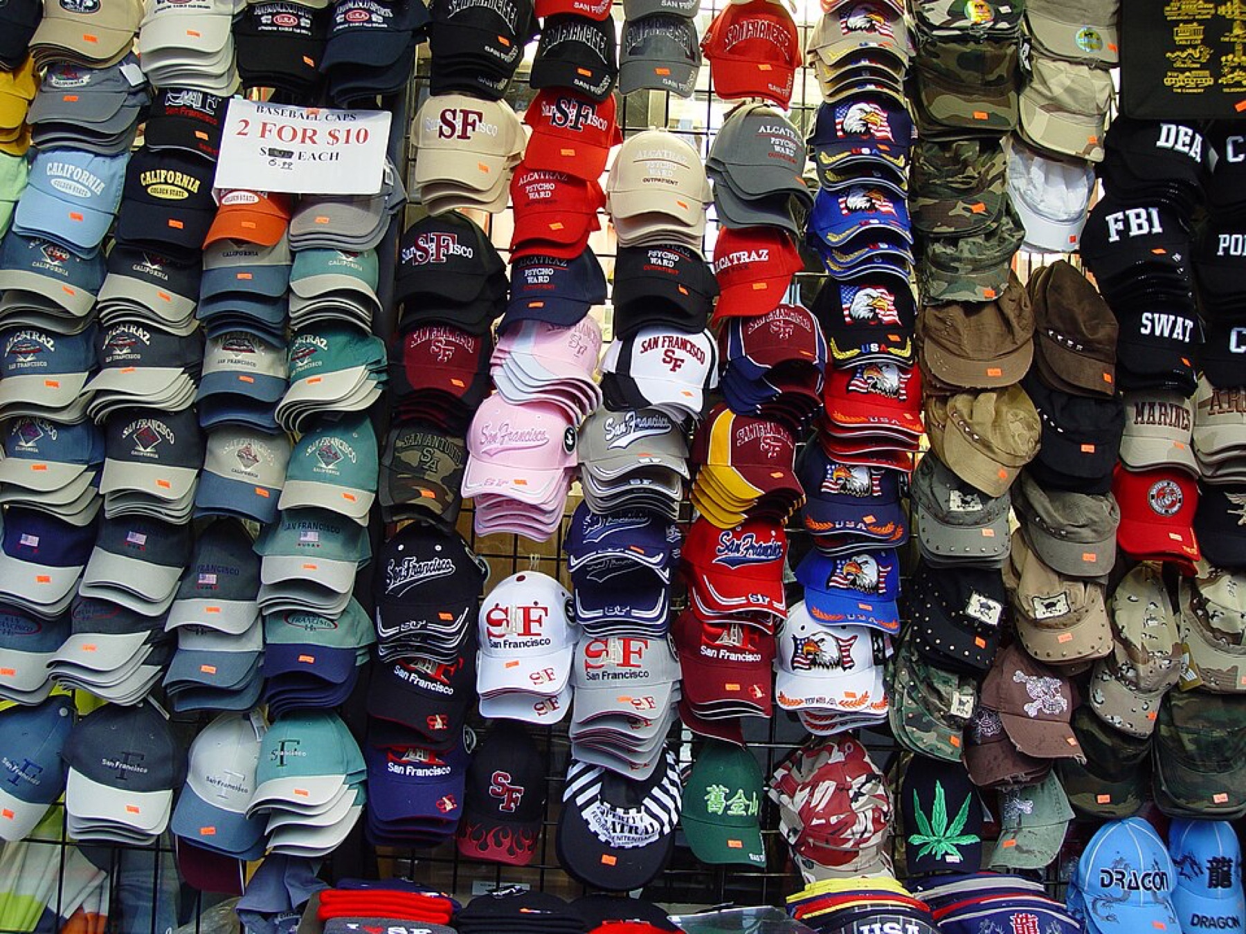 Assorted hats displayed in a shop, illustrating variety of wholesale and retail headwear options