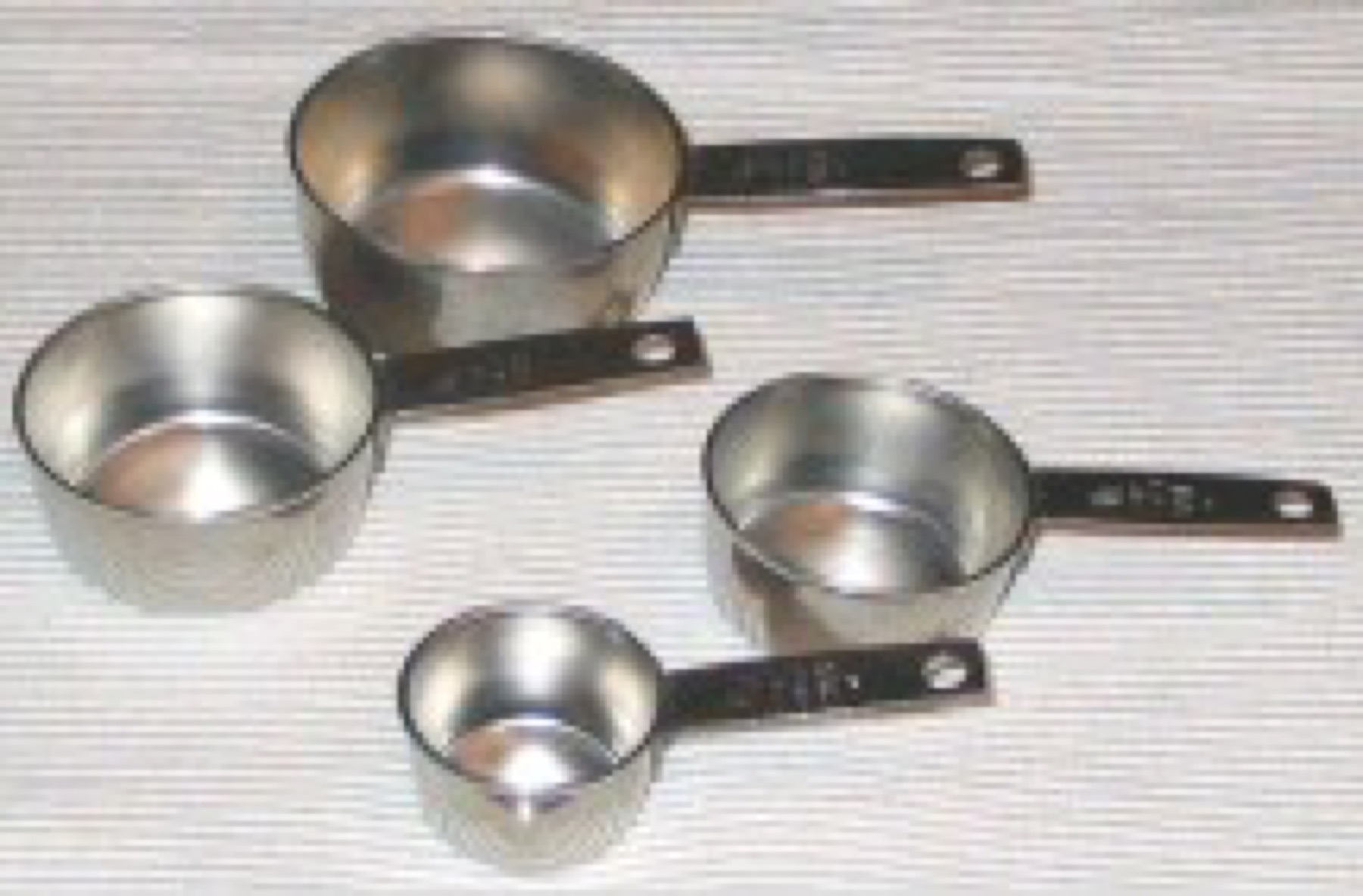Assorted measuring cups on a kitchen counter