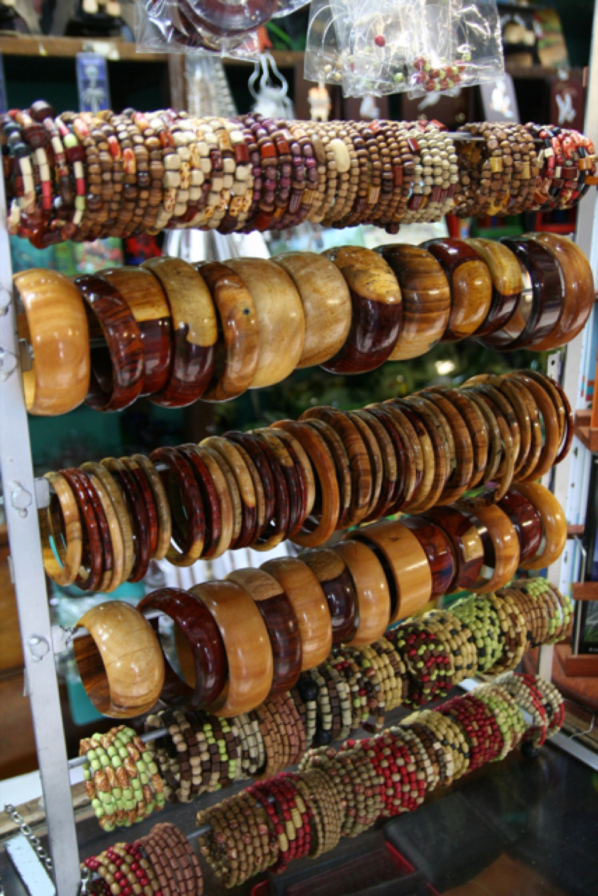 Assorted wood bangle bracelets arranged together