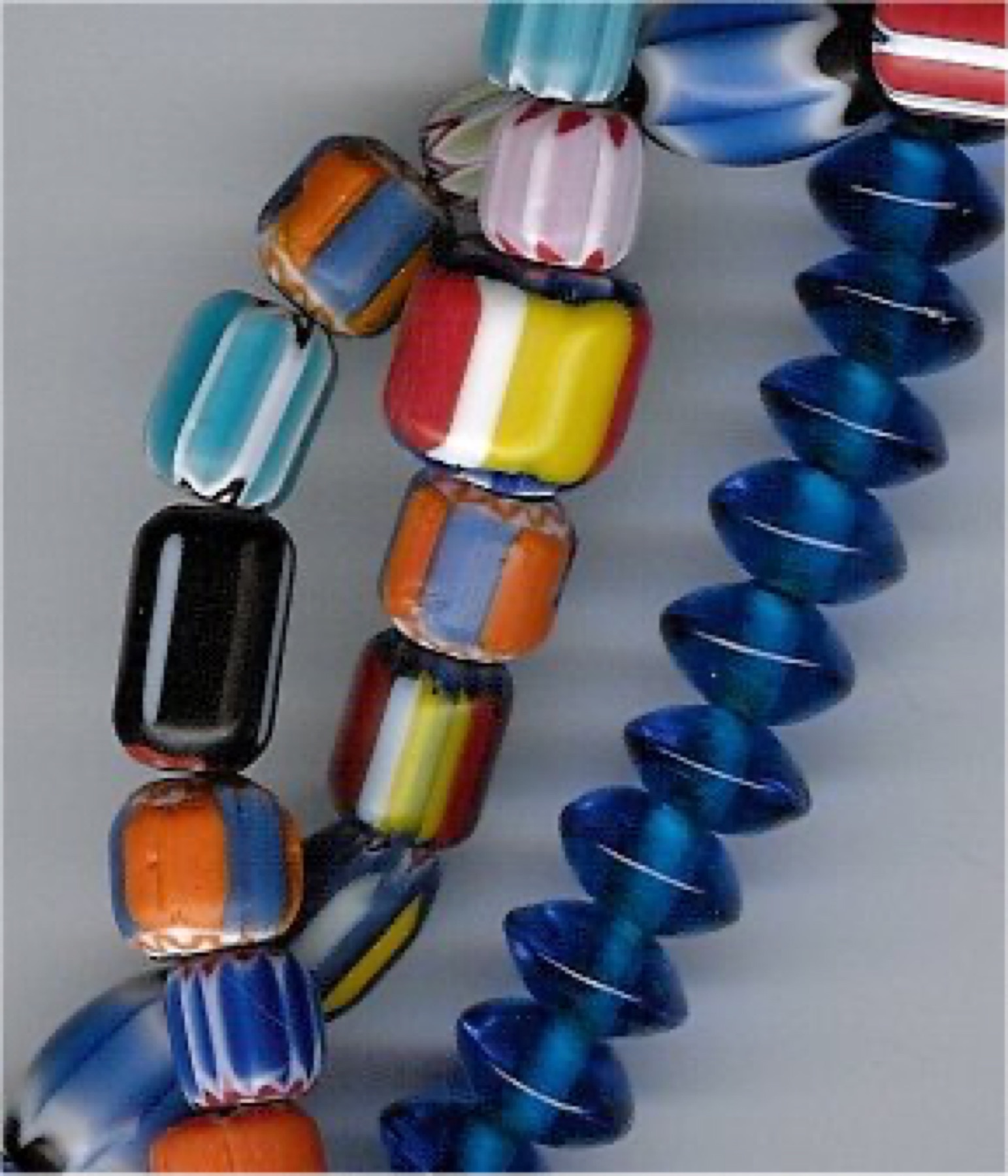 Assorted colorful beads scattered on a flat surface