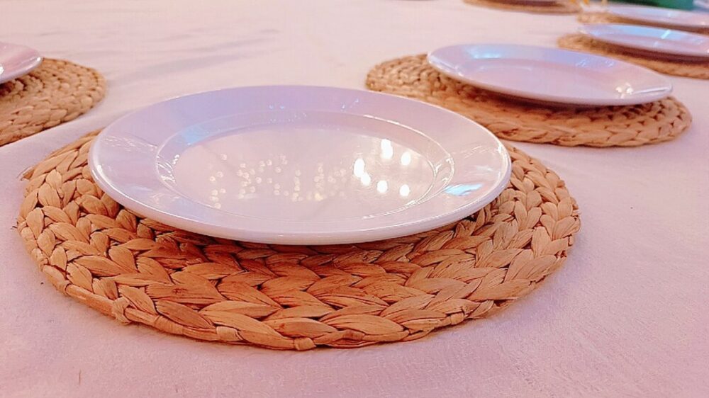 Natural fiber charger plate made from sisal, similar in look to woven rattan chargers