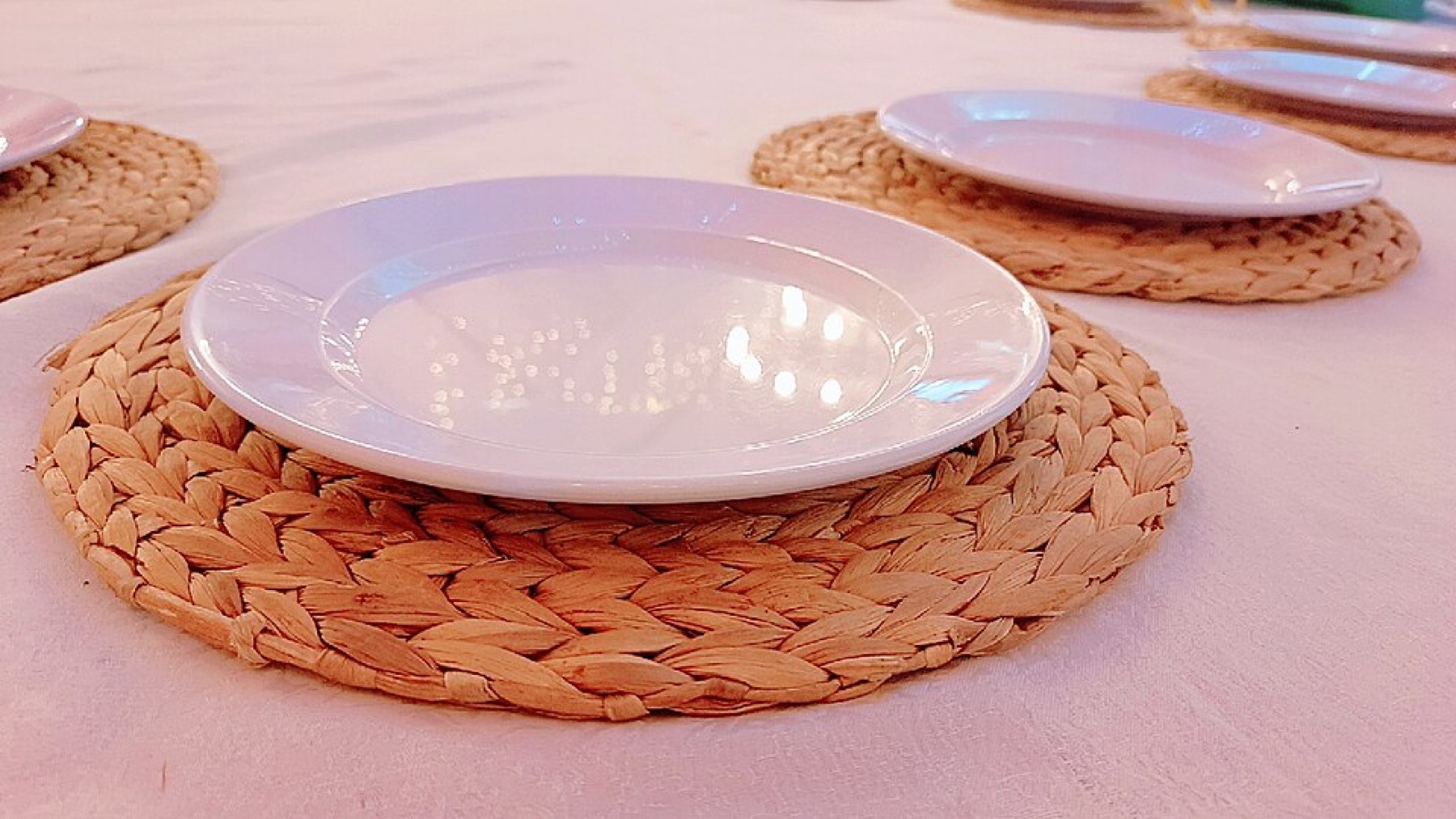 Natural fiber charger plate made from sisal, similar in look to woven rattan chargers