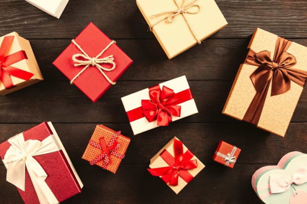 Bulk Christmas presents wrapped and ready for group gifting