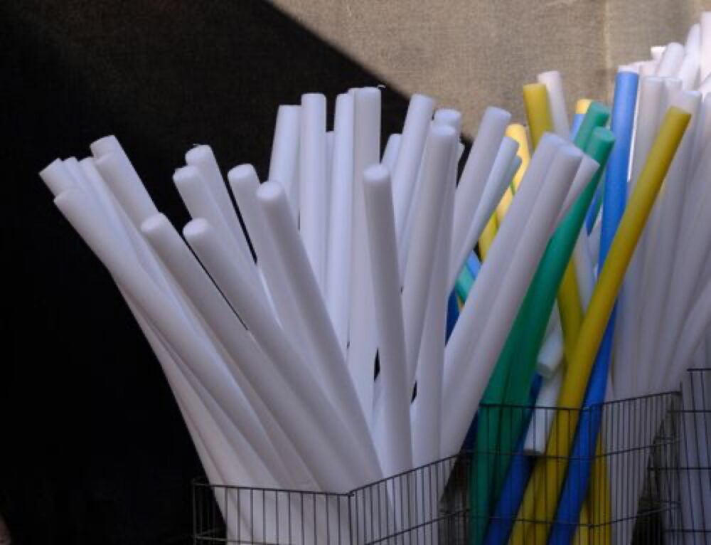 Colorful foam tubes illustrating bulk pool noodle variety