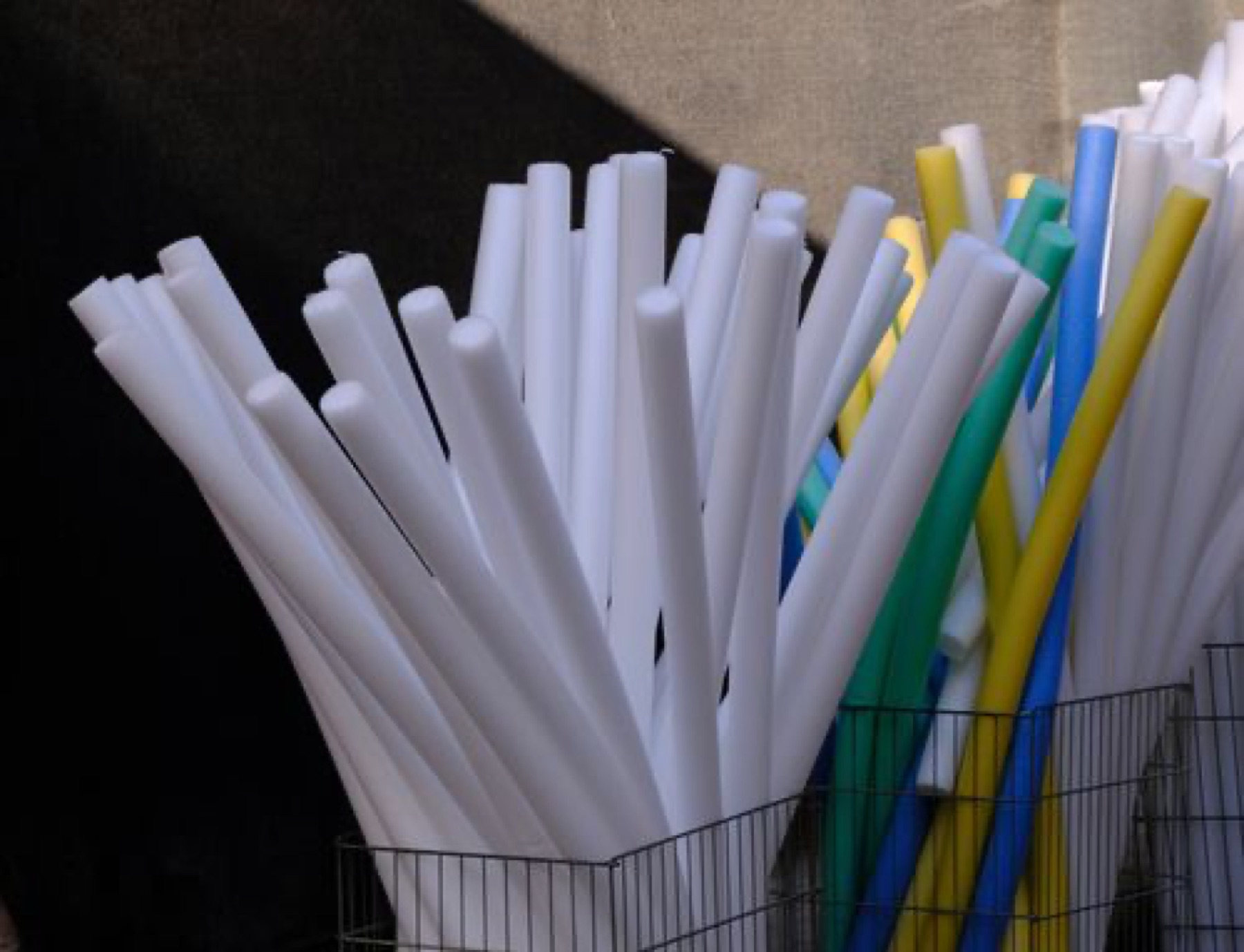 Colorful foam tubes illustrating bulk pool noodle variety