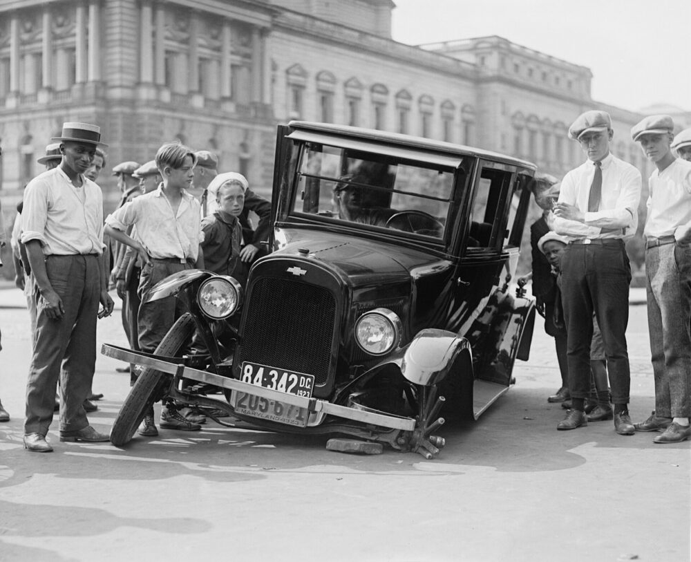 Vintage car accident scene illustrating the stakes of automotive decisions