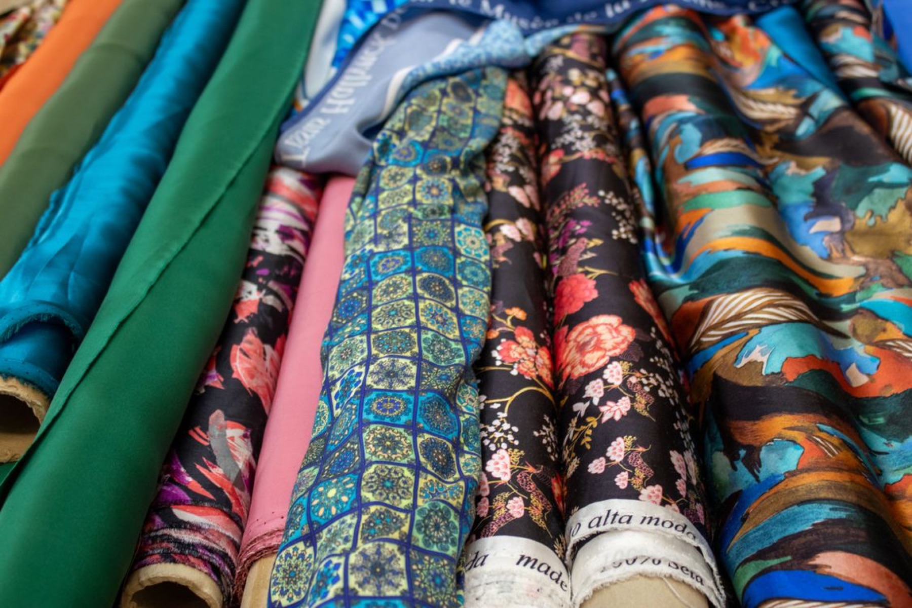 Buyer reviewing fabric swatches and notes before placing an order