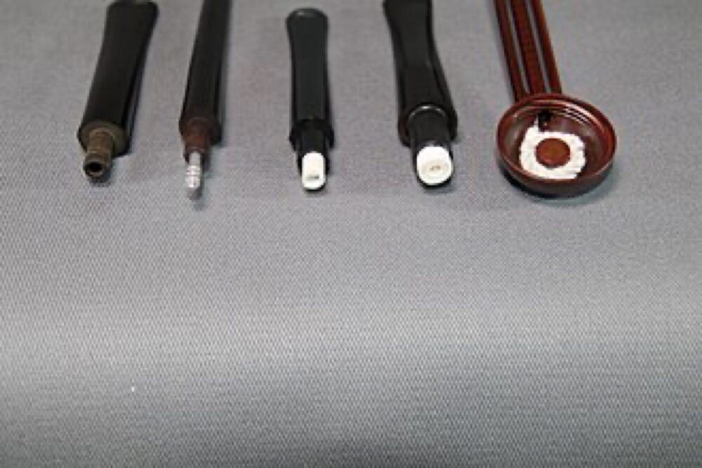 Glass and ceramic smoking filter types, including cylindrical and tapered designs, laid out side by side on a neutral background.