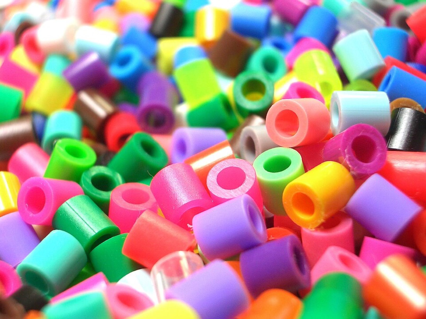 Mixed plastic beads illustrating multi-component jewelry kits and assortments