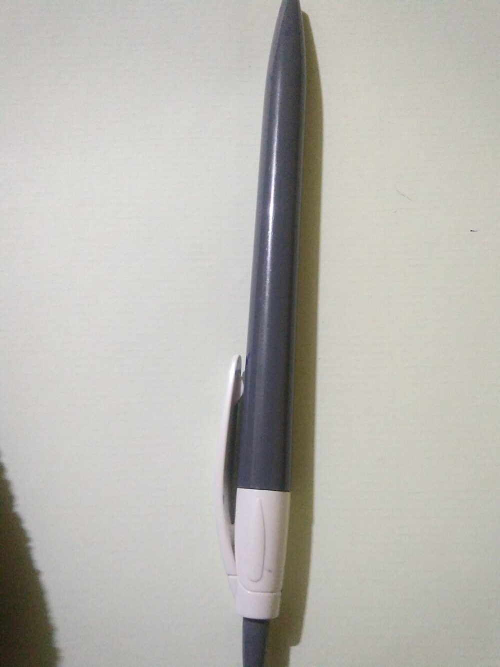 Close-up of a Flair-style felt tip pen on a white background.
