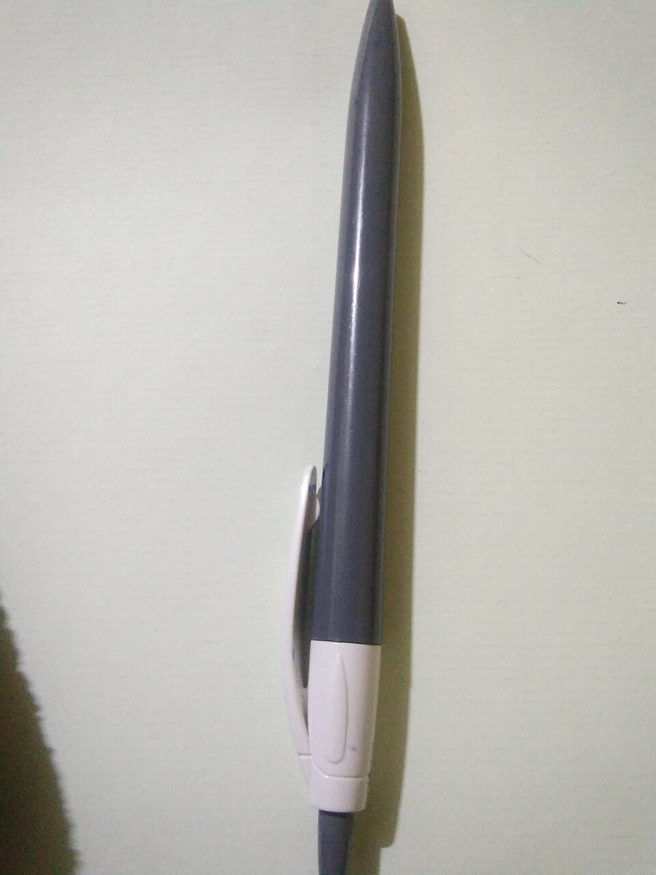 Close-up of a Flair-style felt tip pen on a white background.