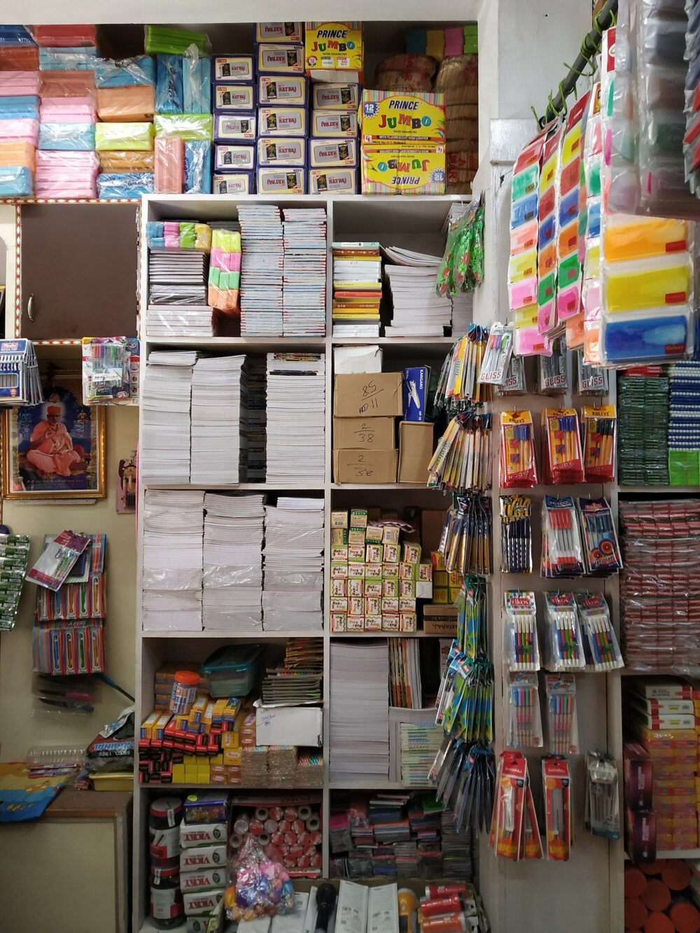 Bulk notebooks stacked in a stationery wholesale shop
