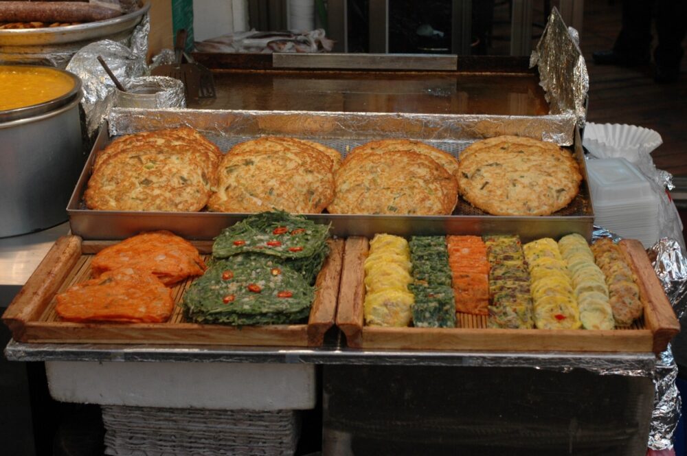 Food stalls in a Korean market, representing the local commerce ecosystem