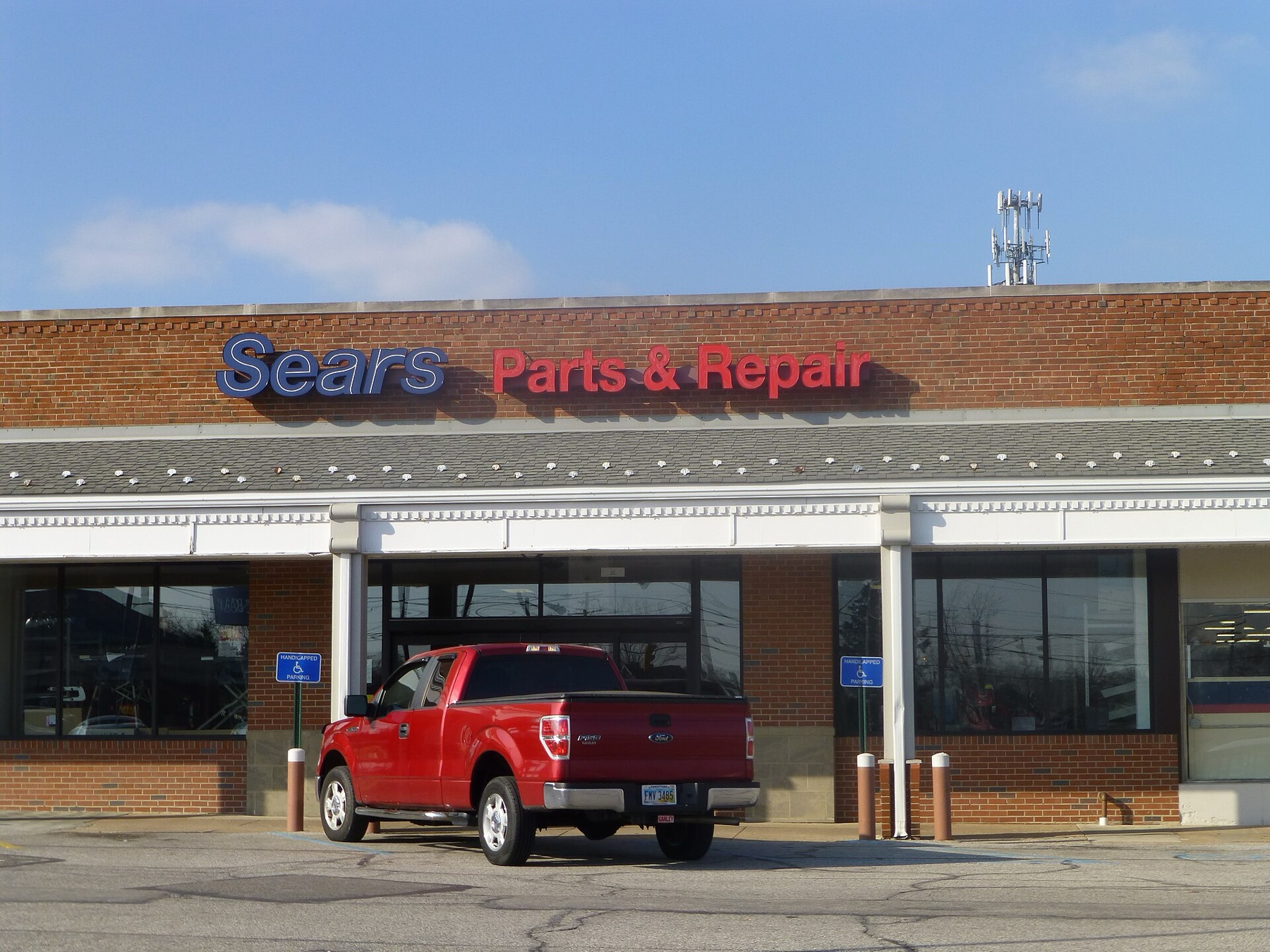 Exterior view of a parts and repair storefront representing vehicle components sourcing