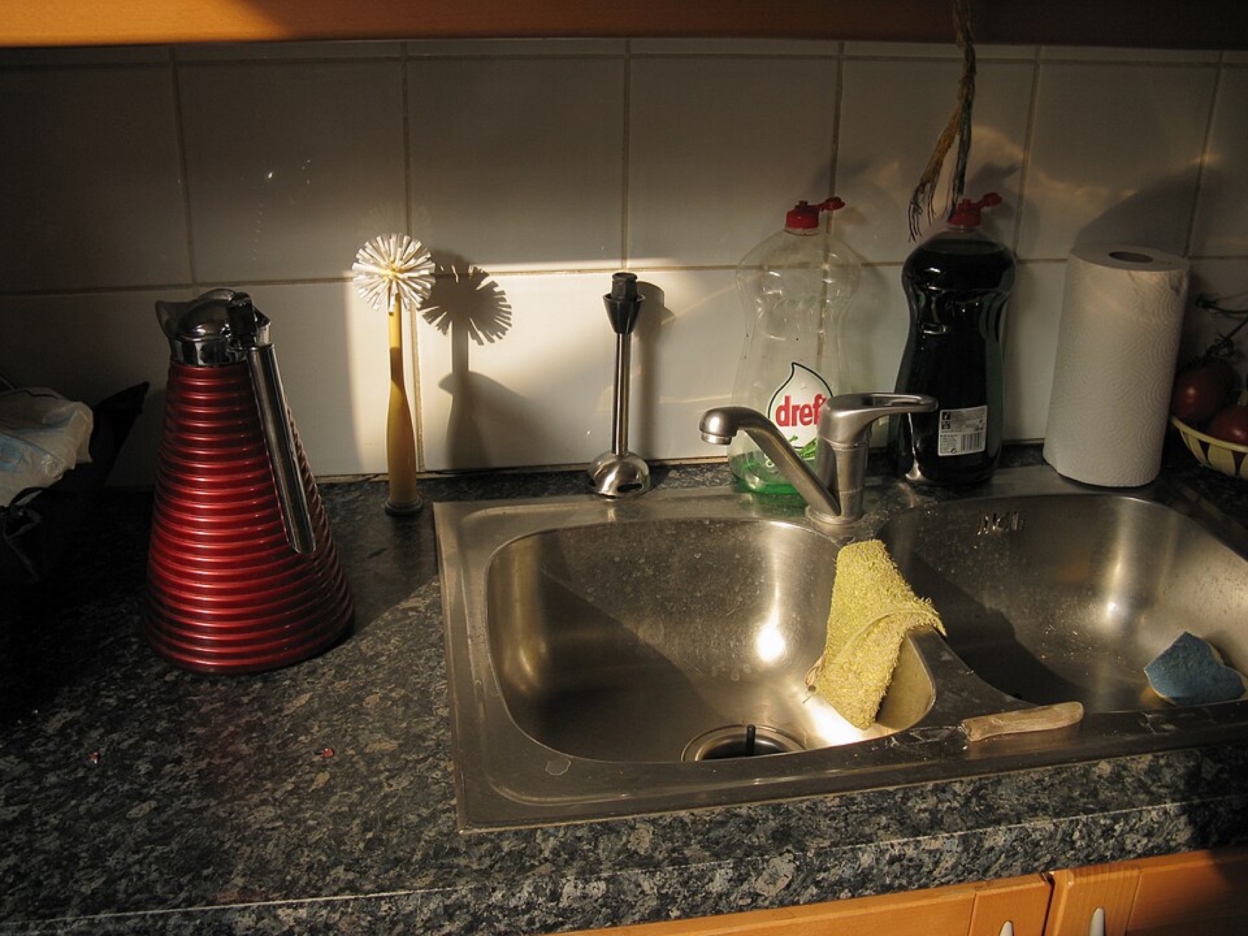 Stainless steel kitchen sink installed in countertop