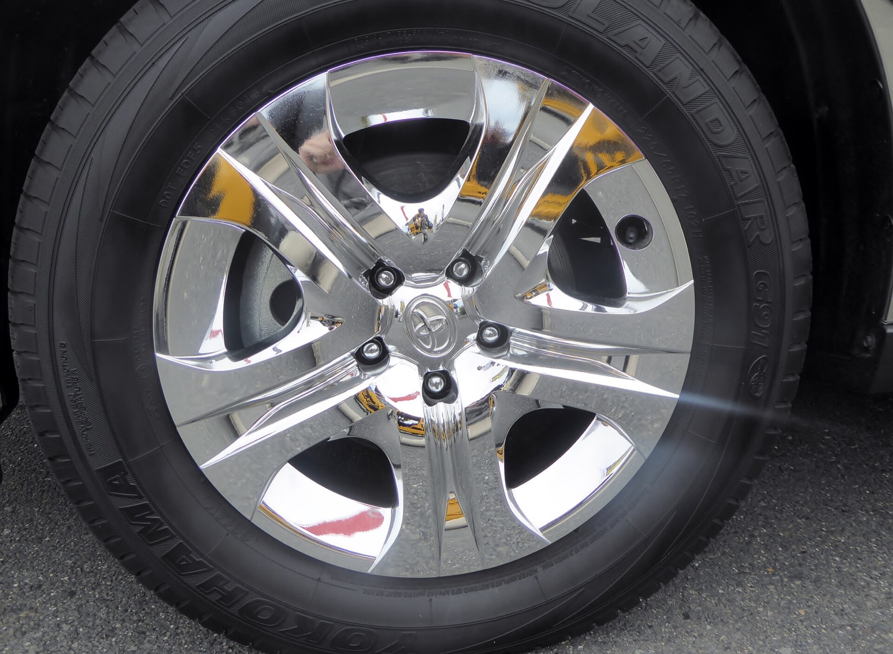 Close-up of a Toyota alloy wheel showing the center cap area