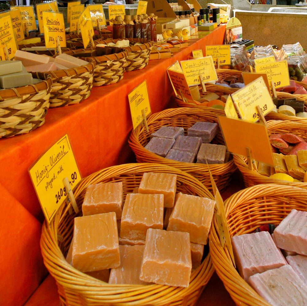 Assorted bulk soap bars displayed at a market stall