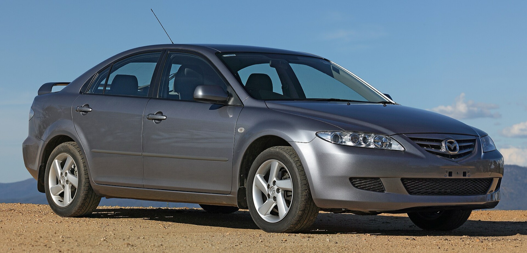 Mazda hatchback parked outdoors, typical use case for sun shades