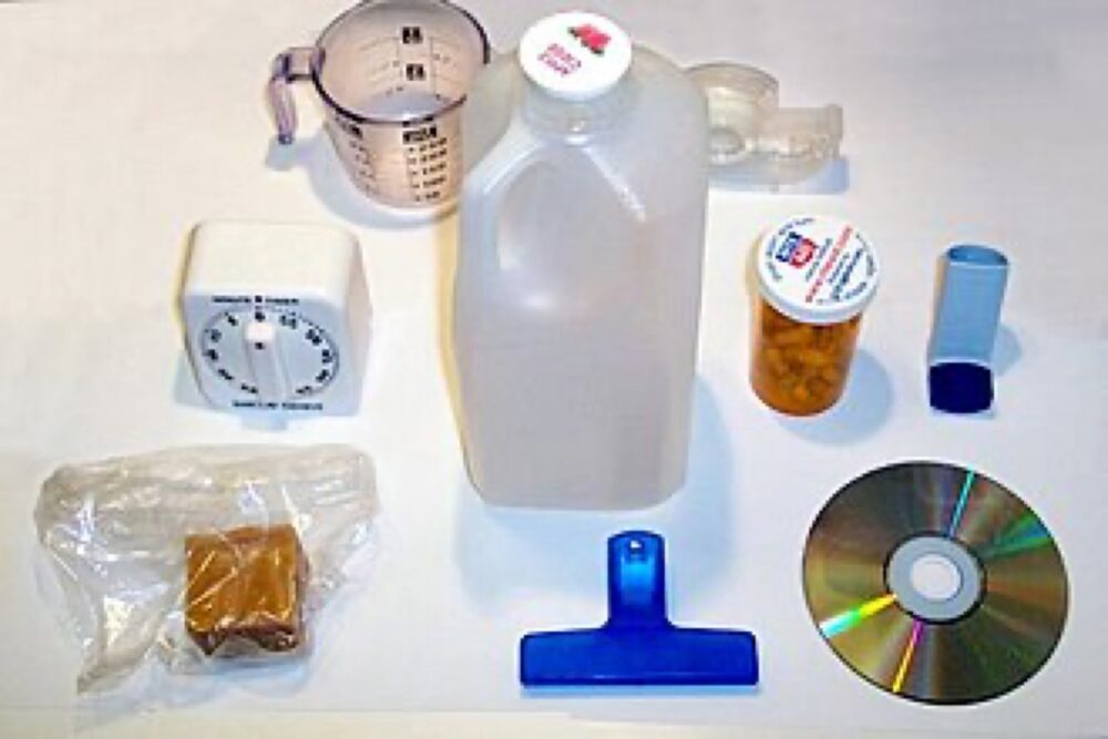 Assorted plastic containers and household items of various sizes