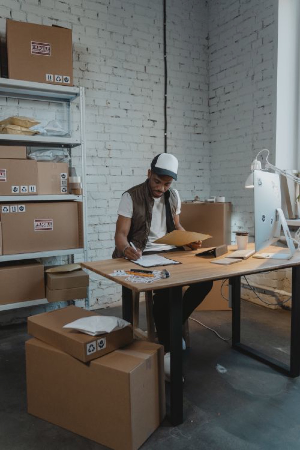Small ecommerce warehouse with shelves of inventory, illustrating multi-channel jewelry sourcing