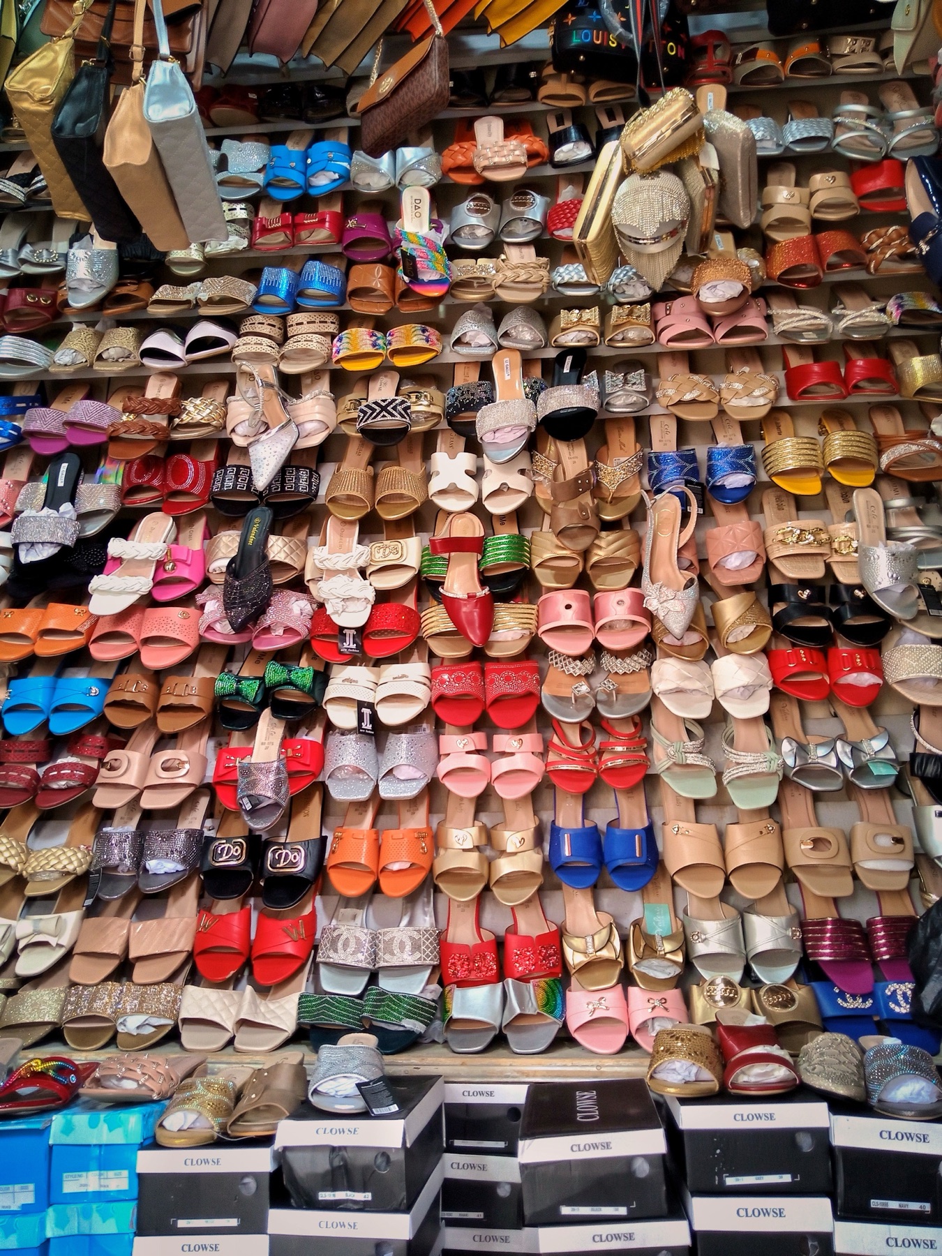 Shelves of shoes in a store, representing variety of Chinese-made footwear options