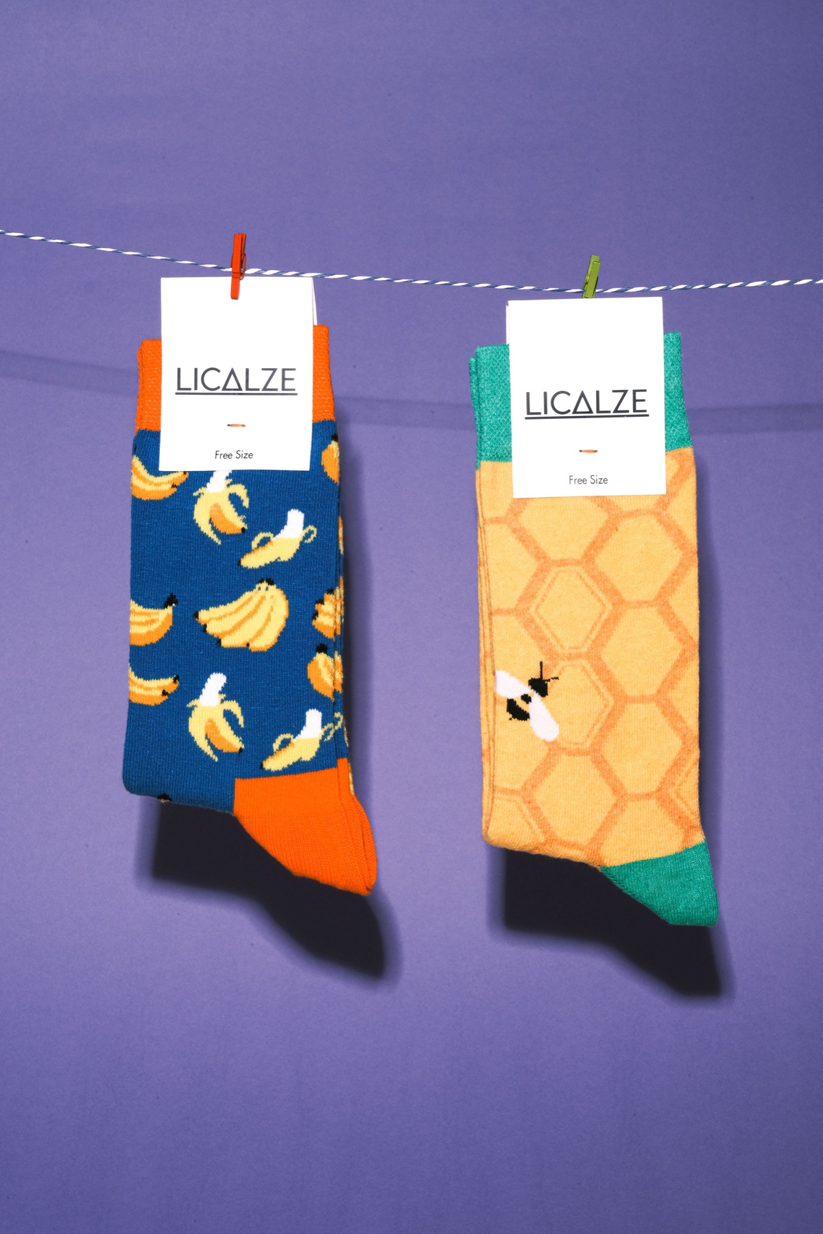 Colorful socks hanging on a string, illustrating bulk sock assortment choices
