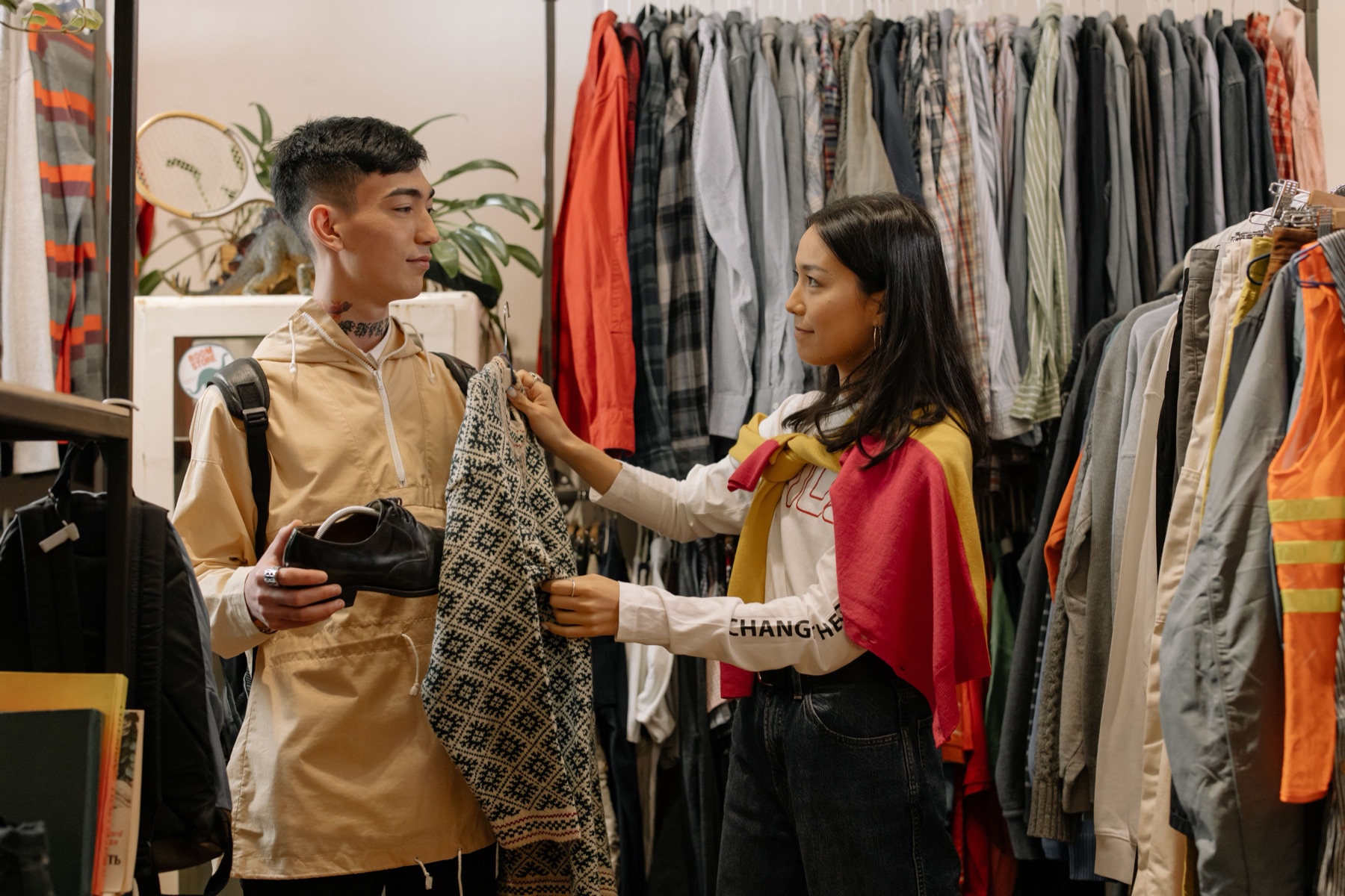 Clothing racks in a boutique illustrating assortment choices for Amazon sellers