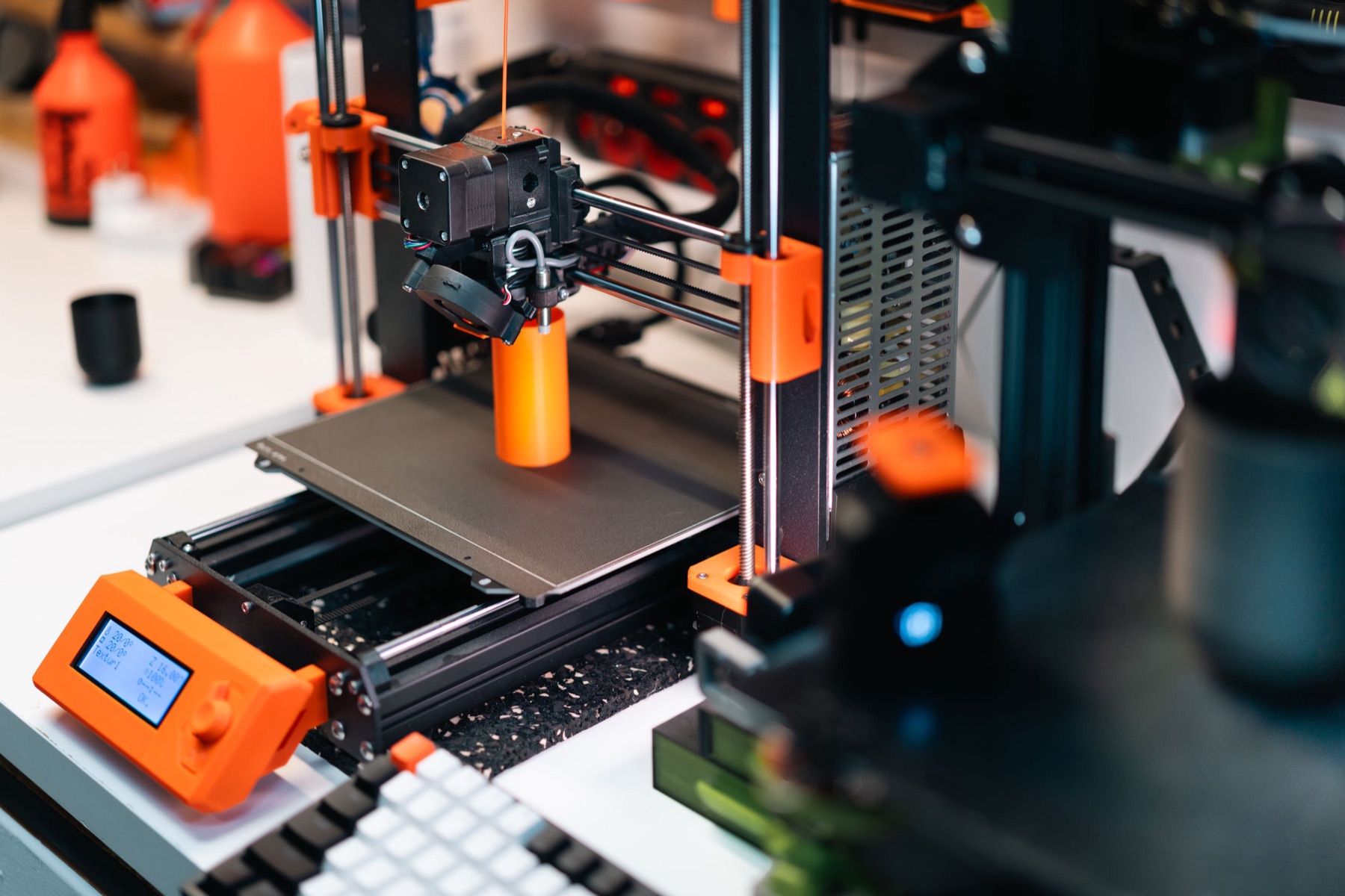 Close-up of a 3D printer producing a plastic part, representing technical equipment that needs careful vetting