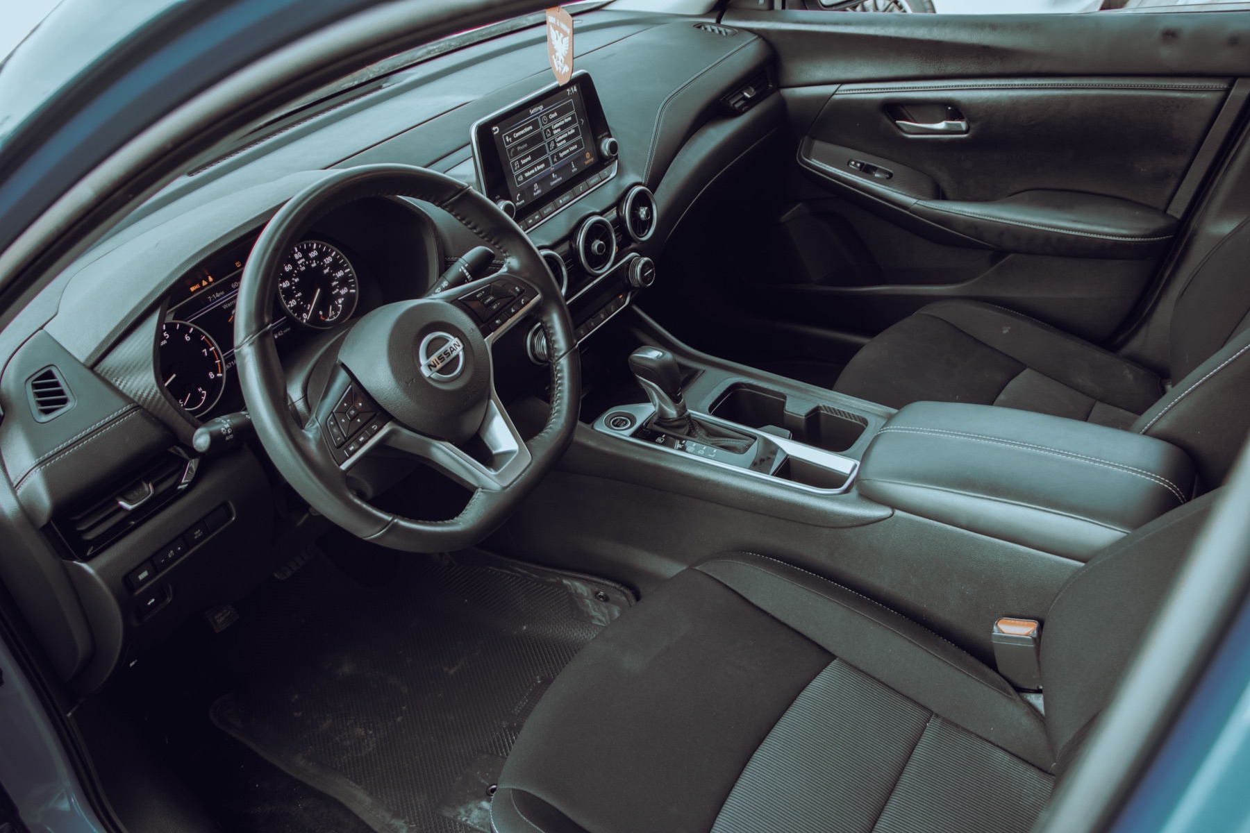 Interior of a sedan illustrating leather seat sourcing context